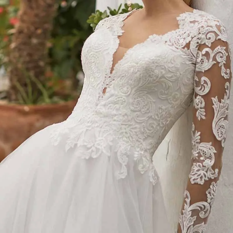 A-Line/Princess Tulle/Long Sleeve Zipper Wedding Dress With Appliqued